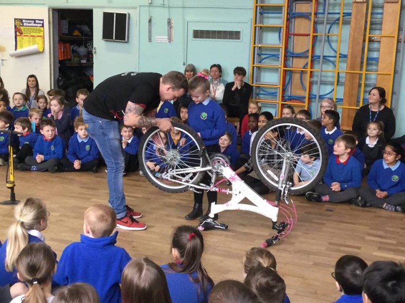 Puncture race with teacher in assembly
